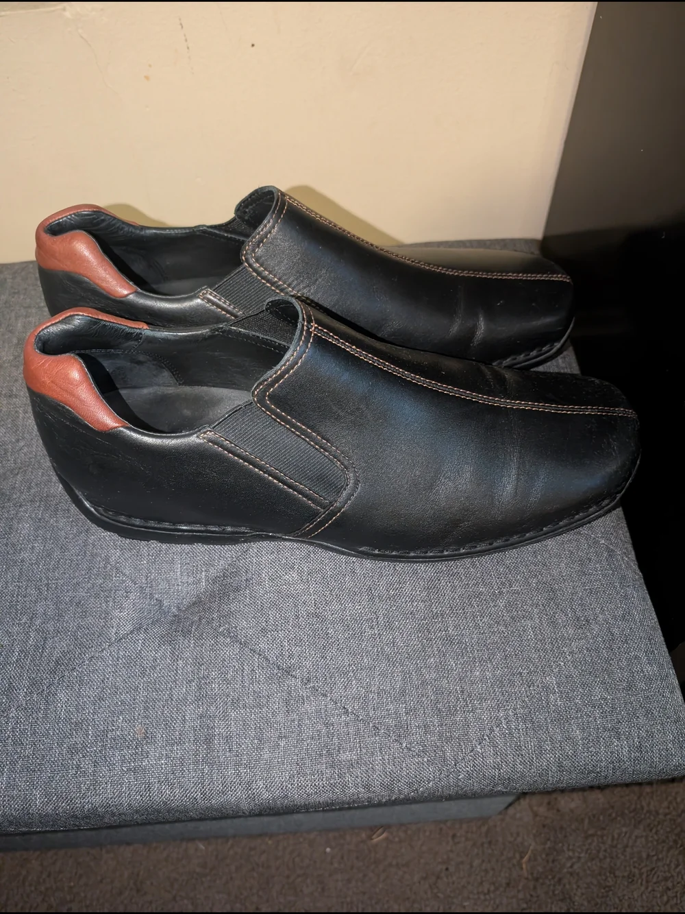 Cole Haan Black Leather Slip-On Loafers with Brown Heel Accent
